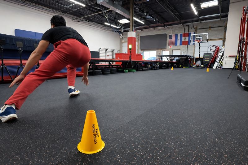 Athlete completing a cone agility drill at Vortex